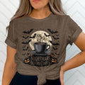 Coffee cup with steam, bats, pumpkins, and text "Nightmare Before Coffee".