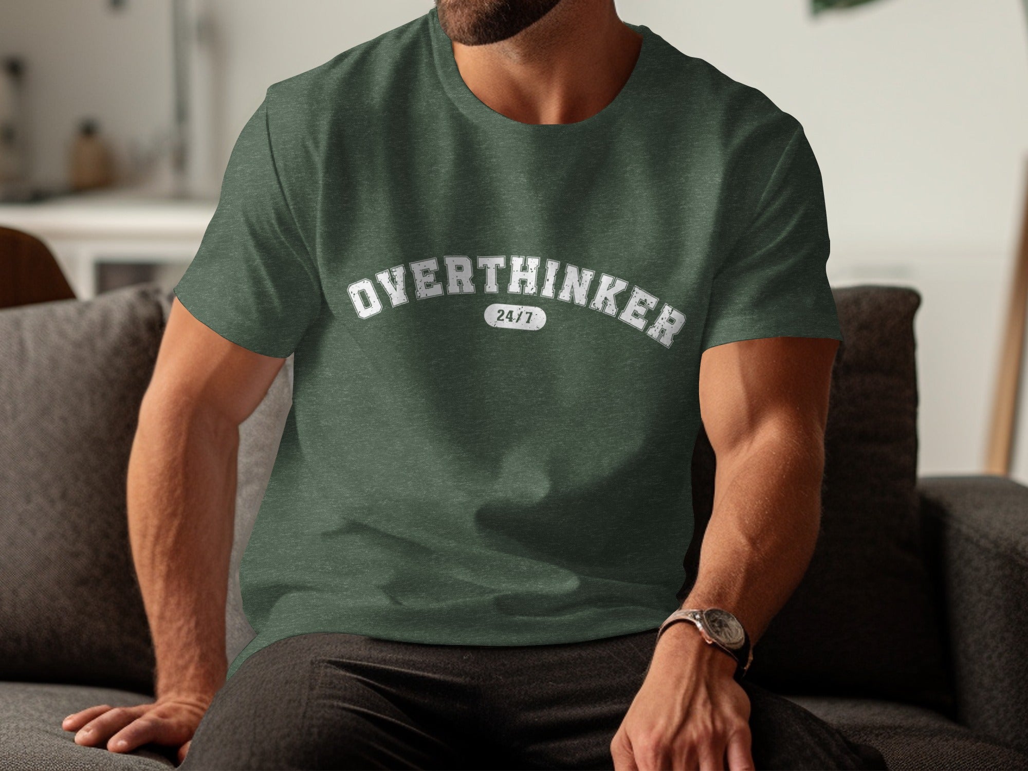 Green t-shirt with distressed white text "OVERTHINKER 24/7" worn by a man.