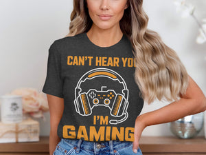 T-shirt with "Can't Hear You I'm Gaming" text, headphones, and game controller graphic.