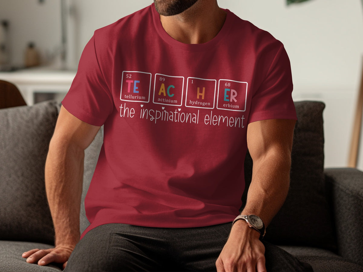 Maroon t-shirt with "TEACHER" spelled using periodic table elements and "the inspirational element".