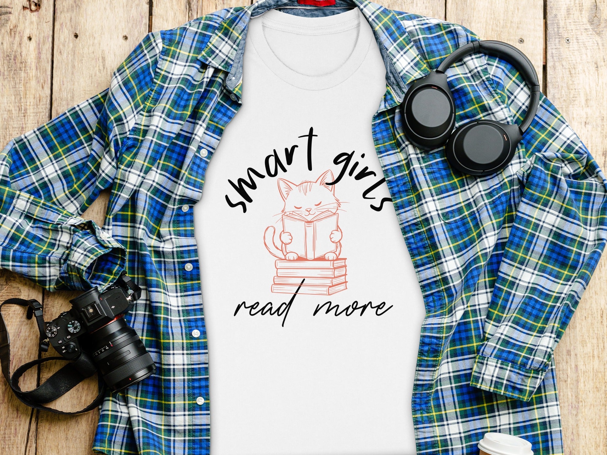 White t-shirt with "smart girls read more" graphic featuring a cat reading a book.