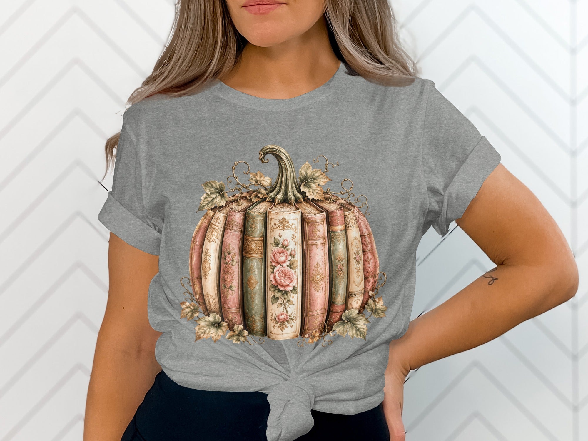 Gray t-shirt featuring a pumpkin made of antique books with floral accents.