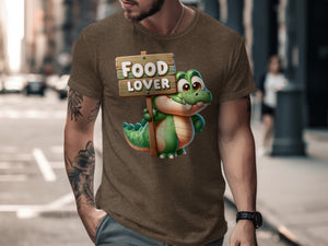 Brown t-shirt featuring a cartoon alligator holding a sign that says "Food Lover."
