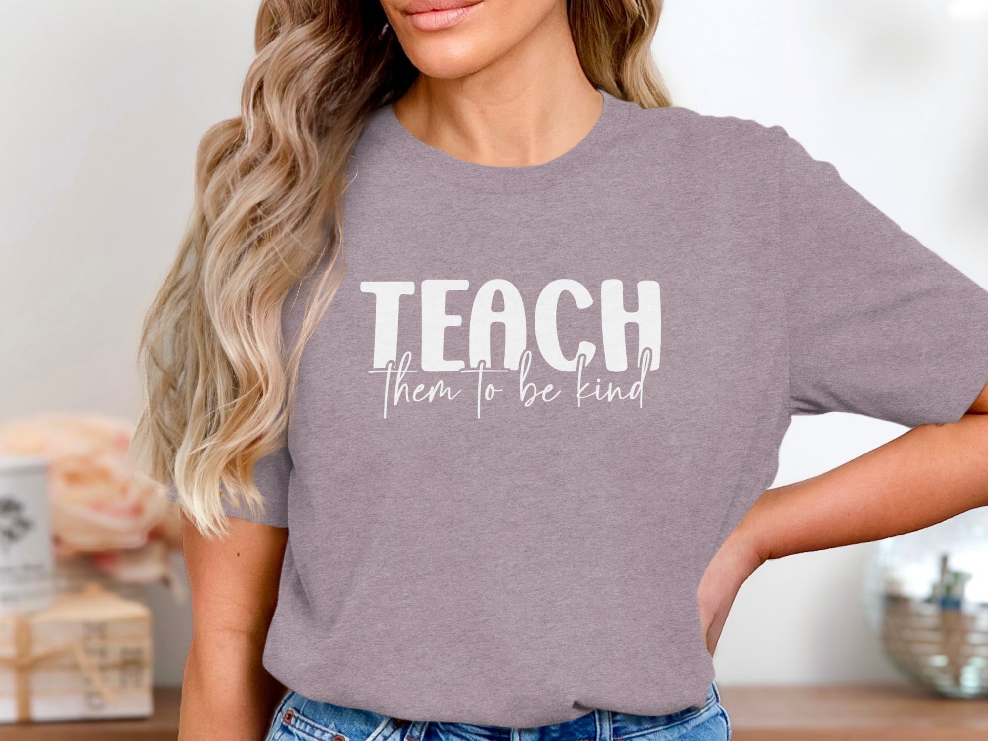 Gray t-shirt with "TEACH them to be kind" text in white.