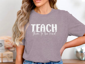 Gray t-shirt with "TEACH them to be kind" text in white.