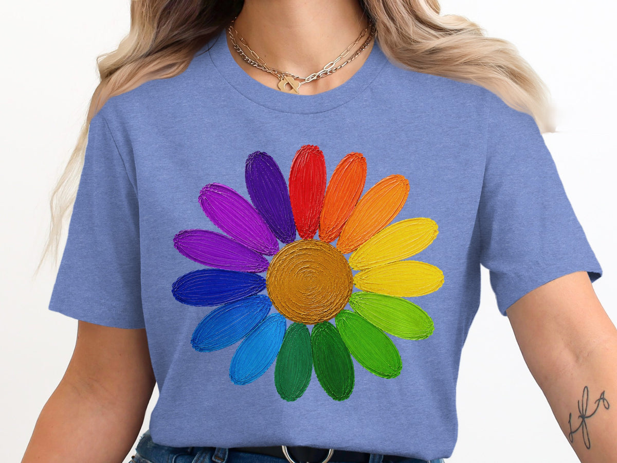 Blue t-shirt with a colorful, textured daisy graphic across the chest.