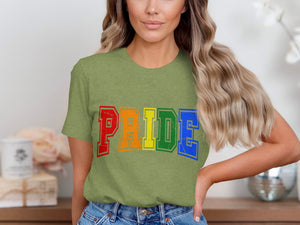 Green t-shirt with "PRIDE" in rainbow-colored block letters.