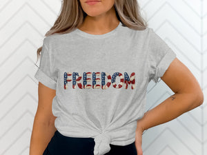 Grey t-shirt with "FREEDOM" text in American flag pattern.