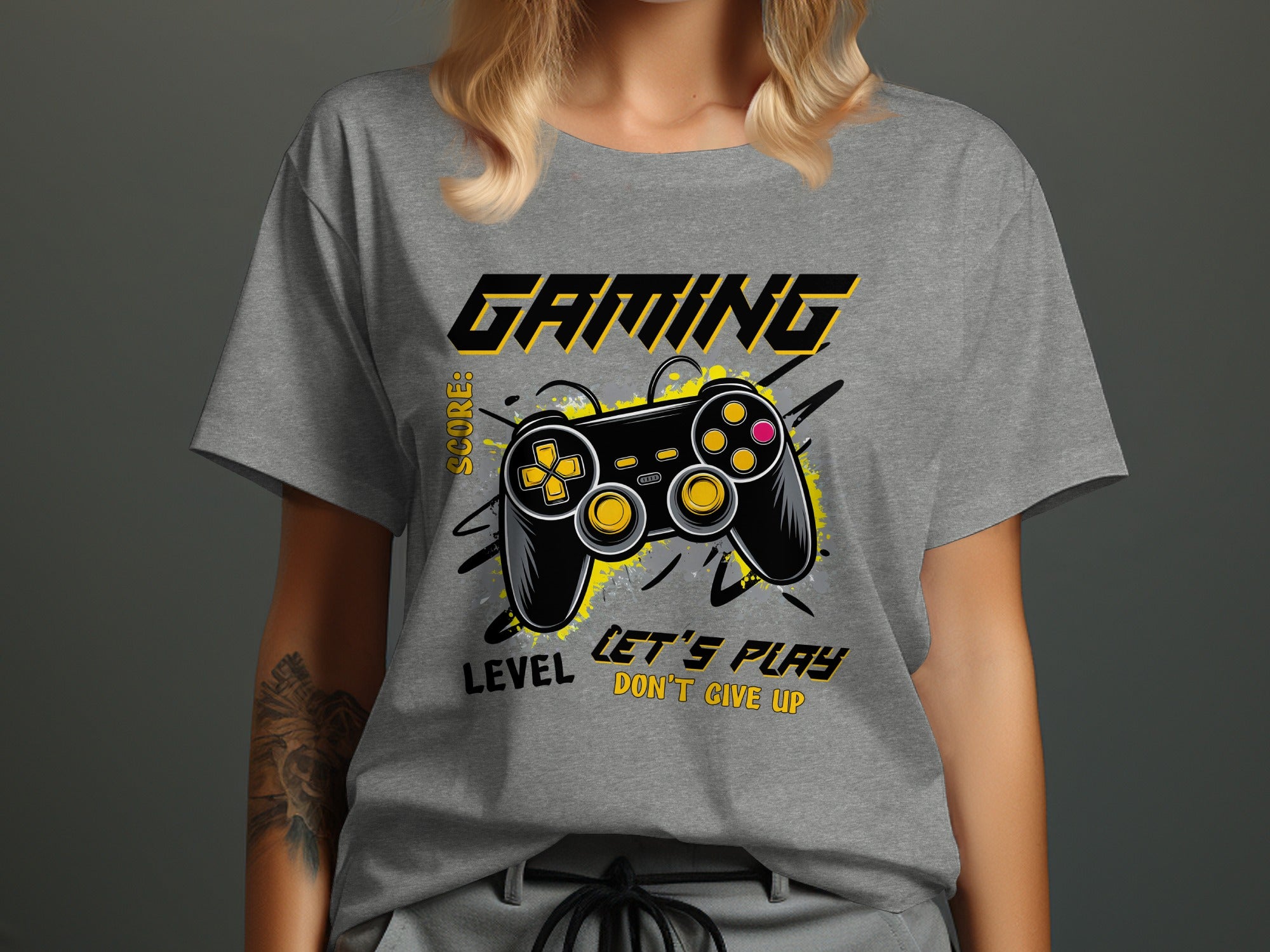 Gray t-shirt with "Gaming" text and a black video game controller with yellow accents.