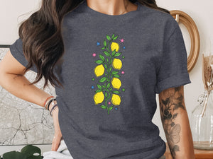 Dark gray t-shirt with a lemon branch and stars illustration on the front.