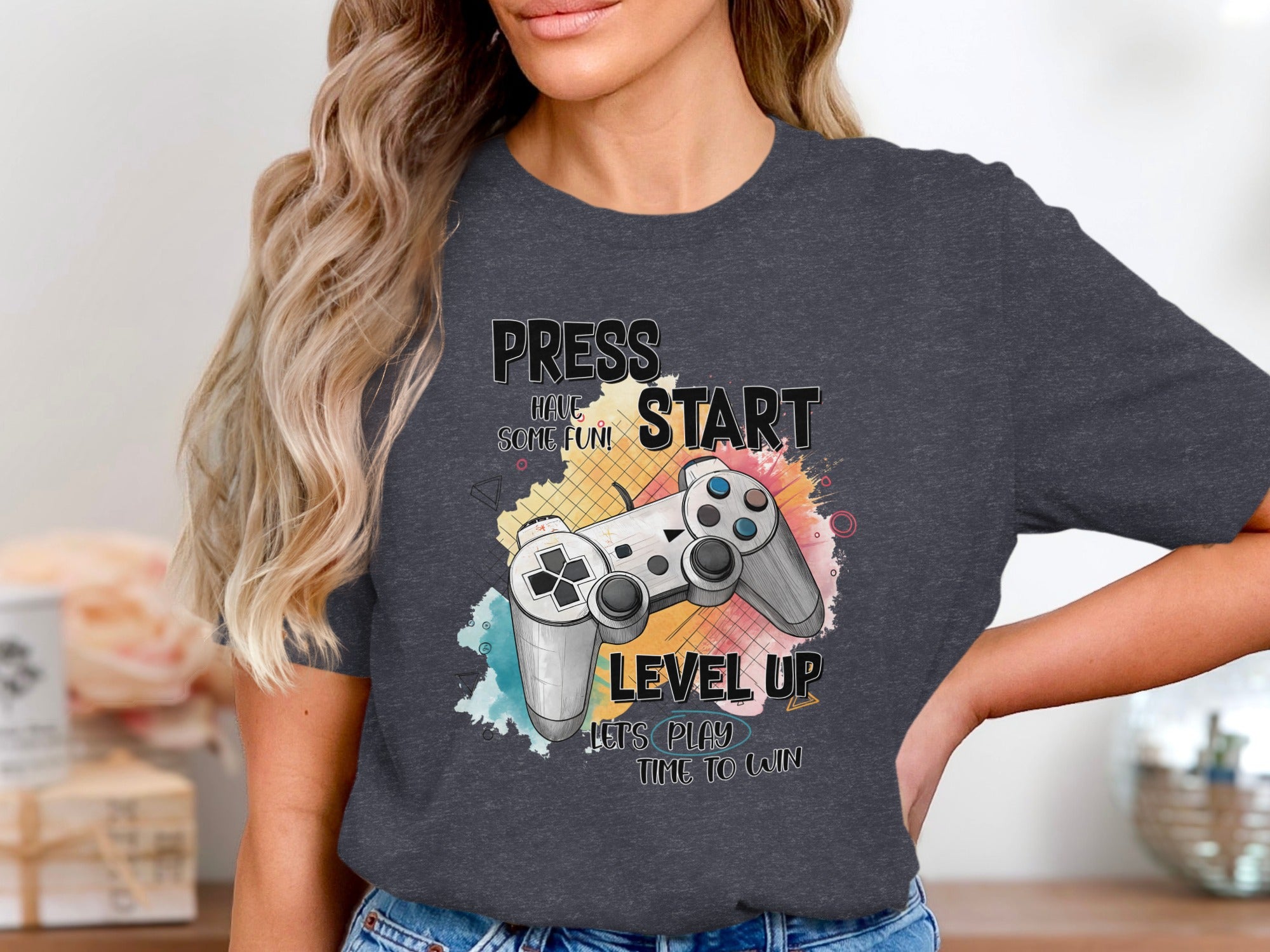 T-shirt graphic with a video game controller and text "Press Start, Have Some Fun! Level Up, Let's Play Time To Win."