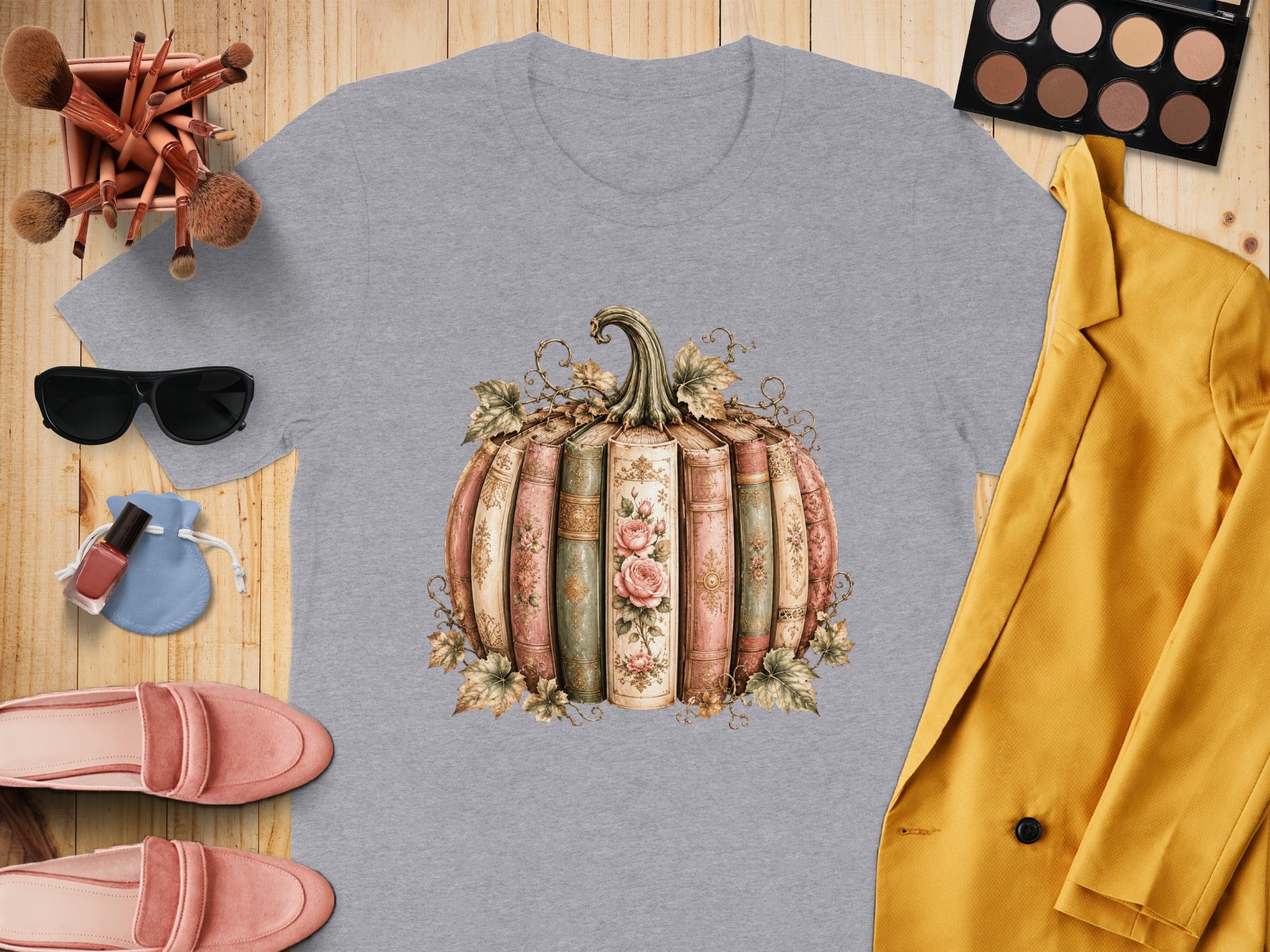 Grey t-shirt with a pumpkin made of antique books graphic.