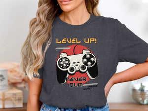 T-shirt with "Level Up! Never Quit Press Start" text and a video game controller graphic.