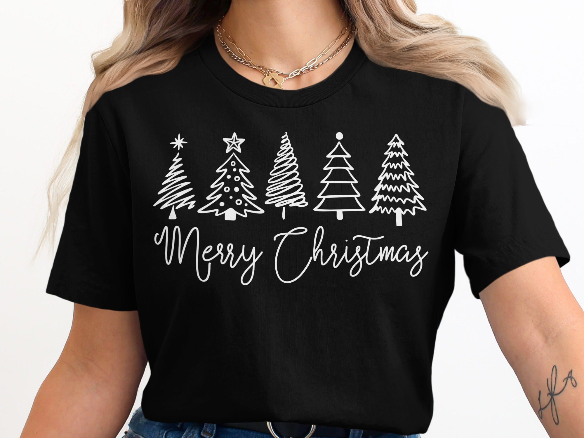 Black t-shirt with white Christmas trees and "Merry Christmas" text.