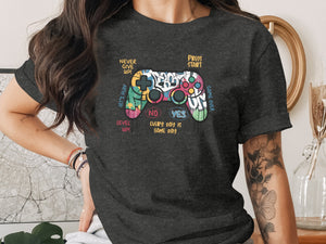 Dark t-shirt with a colorful video game controller graphic and gaming slogans.
