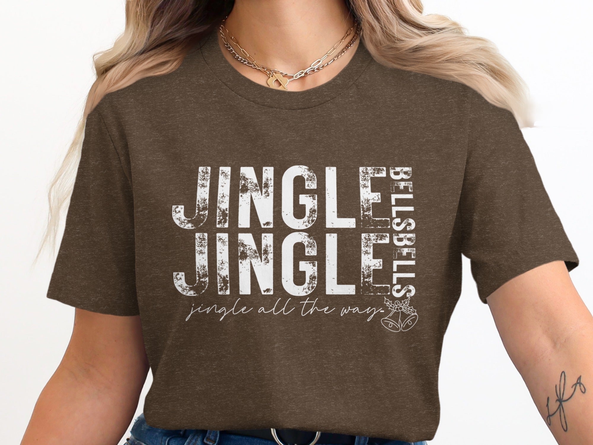 Brown t-shirt with white distressed text reading "JINGLE JINGLE BELLS BELLS jingle all the way."