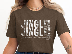 Brown t-shirt with white distressed text reading "JINGLE JINGLE BELLS BELLS jingle all the way."