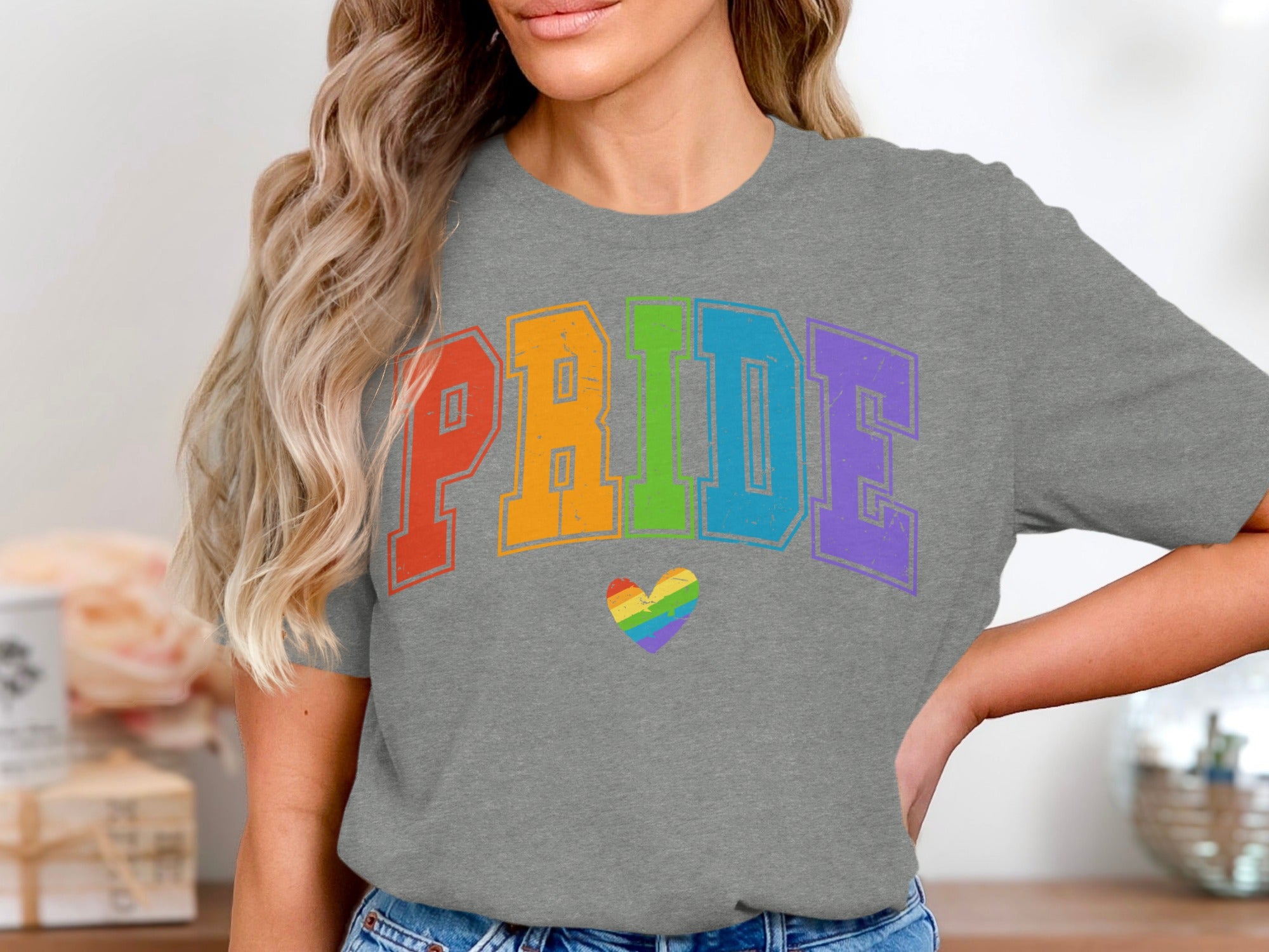 Gray t-shirt with colorful "PRIDE" text and rainbow heart graphic.