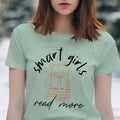 Light green t-shirt with "smart girls read more" and a cat reading on books graphic.