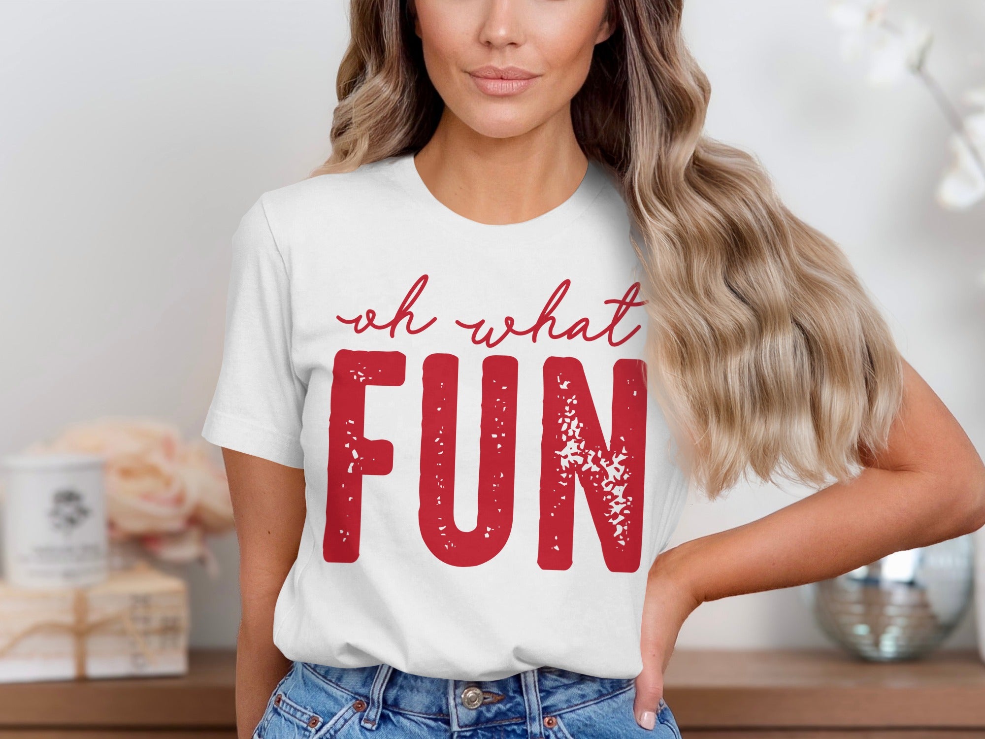 White t-shirt with red text "oh what FUN" with a distressed texture.