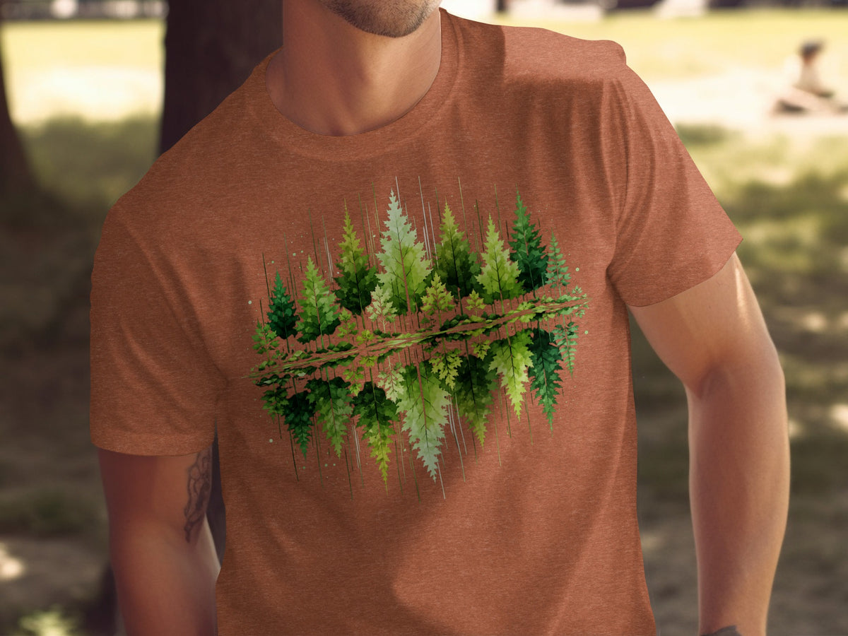 T-shirt with a green forest and water reflection graphic design.