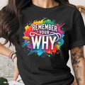 Black t-shirt with colorful "REMEMBER YOUR WHY" graphic and abstract splashes.