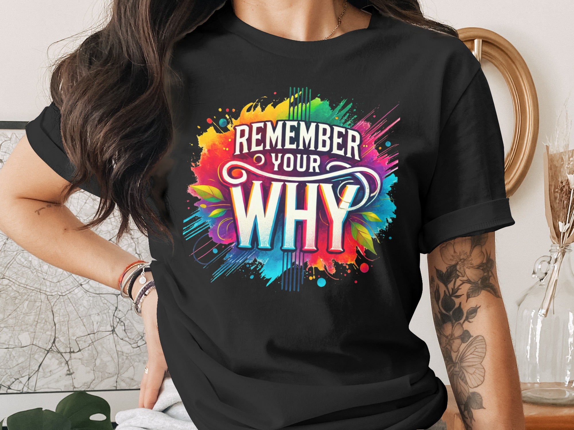 Black t-shirt with colorful "REMEMBER YOUR WHY" graphic and abstract splashes.
