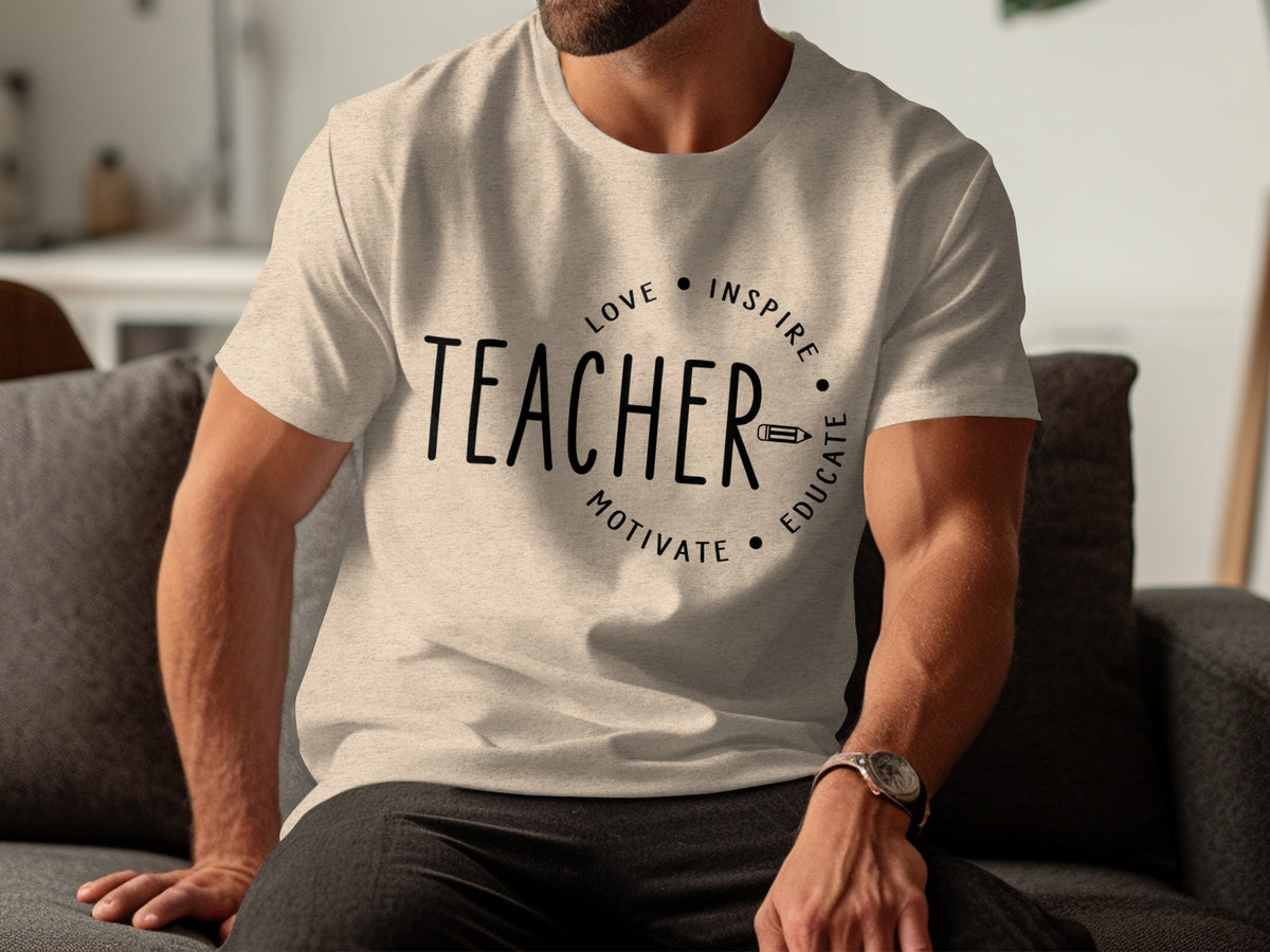Light tan t-shirt with "TEACHER" and "Love Inspire Motivate Educate" text design.
