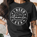 Black t-shirt with a circular white graphic reading "I NEED Vitamin SEA"