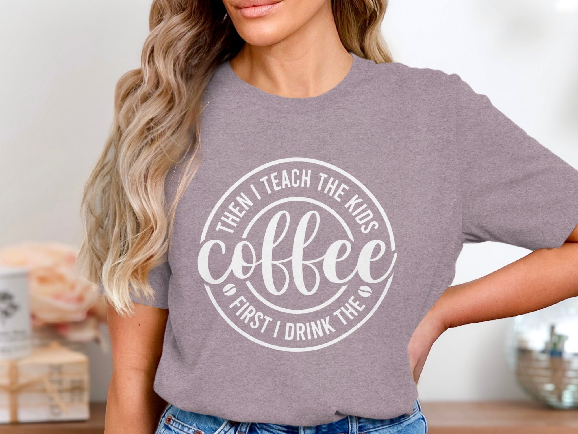 Purple t-shirt with white text: Then I teach the kids, coffee, first I drink the