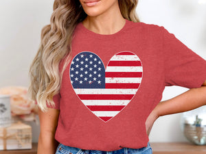 Red t-shirt with distressed American flag heart graphic on chest.