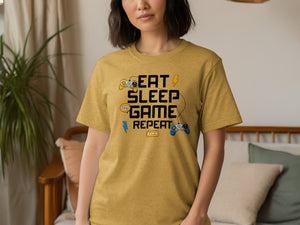 Gold t-shirt with "EAT SLEEP GAME REPEAT" text and gaming graphics.