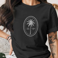 Black t-shirt with oval palm tree graphic reading "Palm Beach Florida 1974".