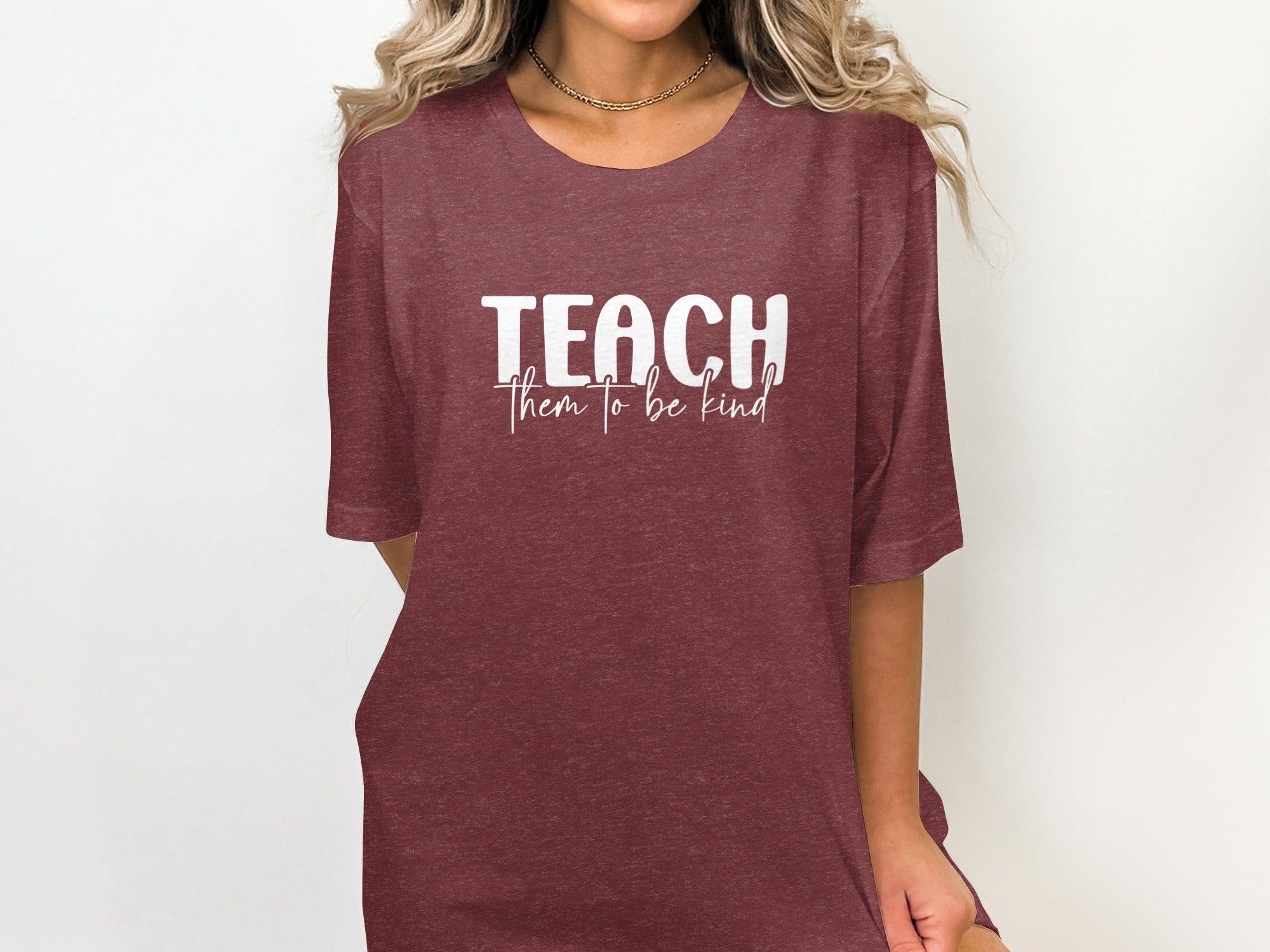 Maroon t-shirt with "TEACH them to be kind" text in white.