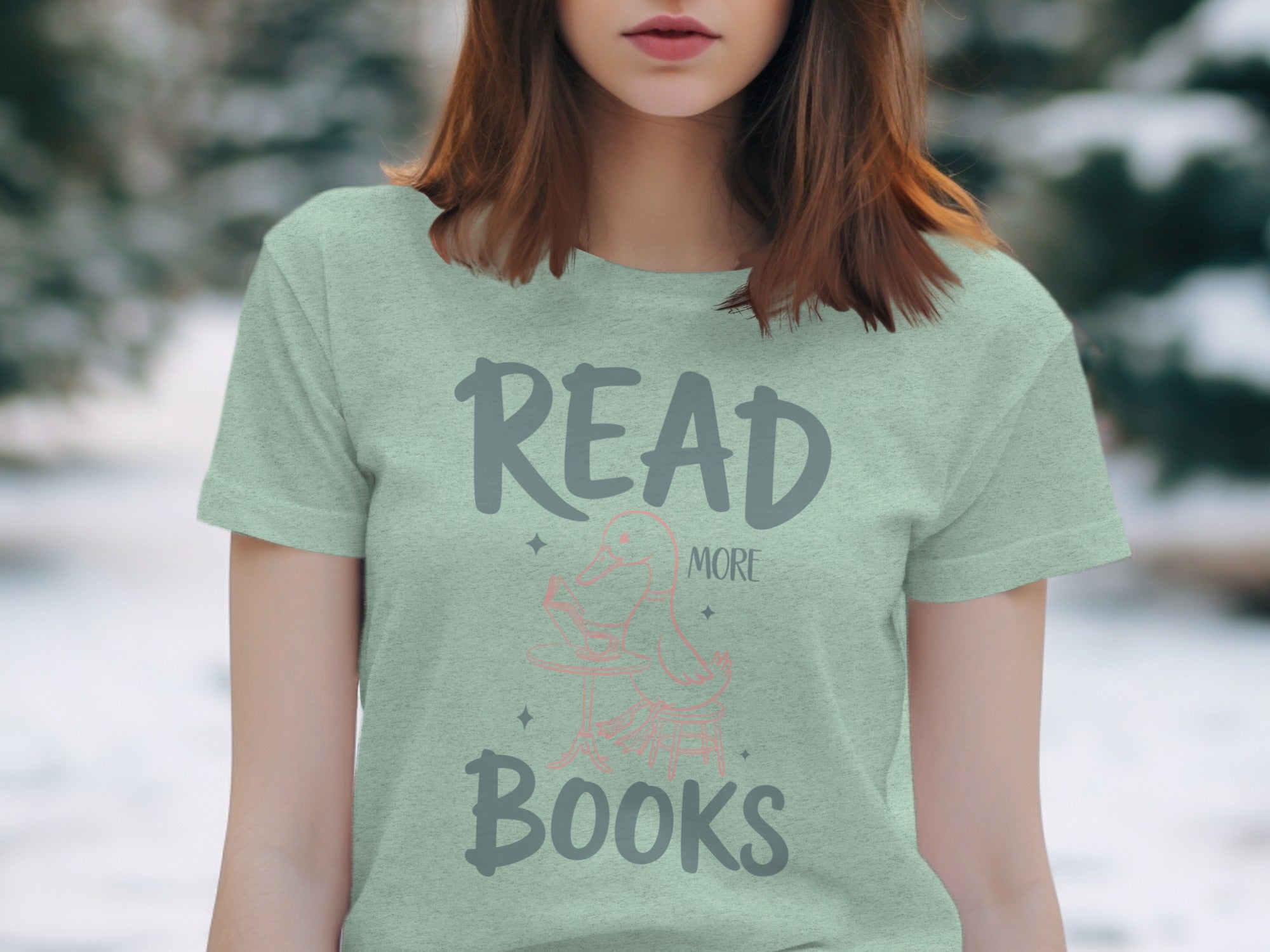 Light green t-shirt with "Read More Books" text and a duck reading a book.