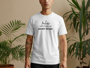 White t-shirt with black text: "failure is found in never trying."
