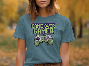 Teal t-shirt with pixelated text "GAME OVER GAMER" above a video game controller.