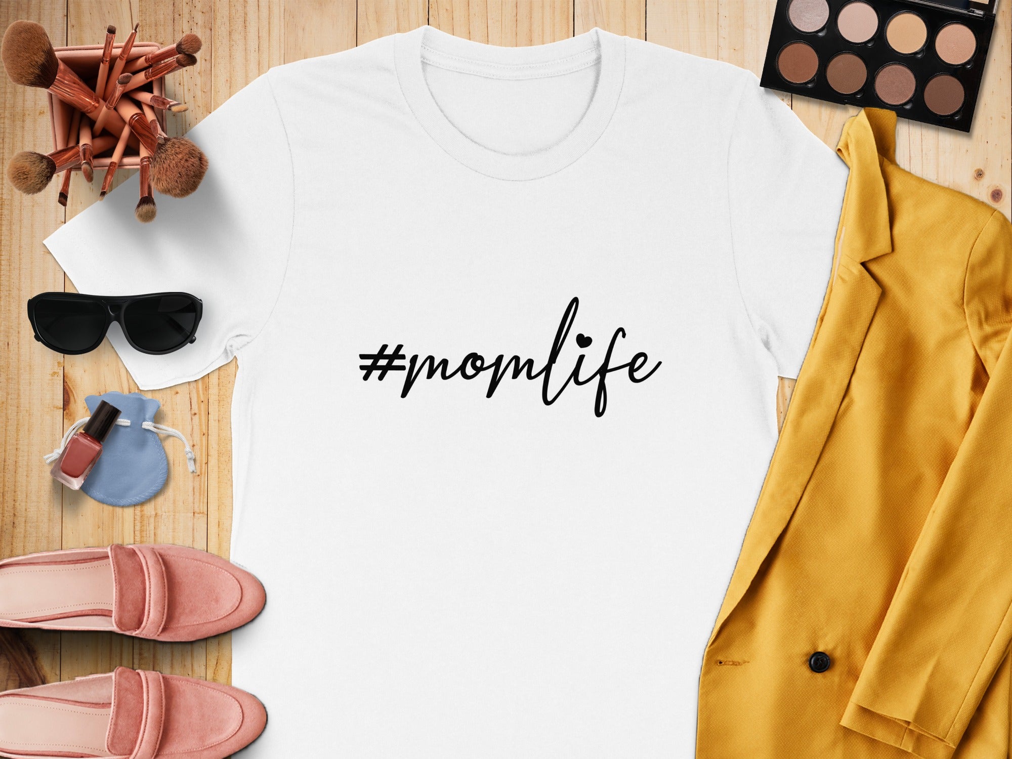 White t-shirt with "#momlife" text and various accessories for a mom.