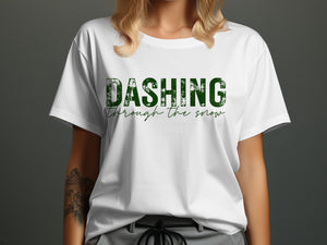 White t-shirt with distressed green text reading "DASHING through the snow."
