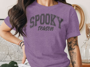 Purple t-shirt with "SPOOKY season" text in gray block letters.