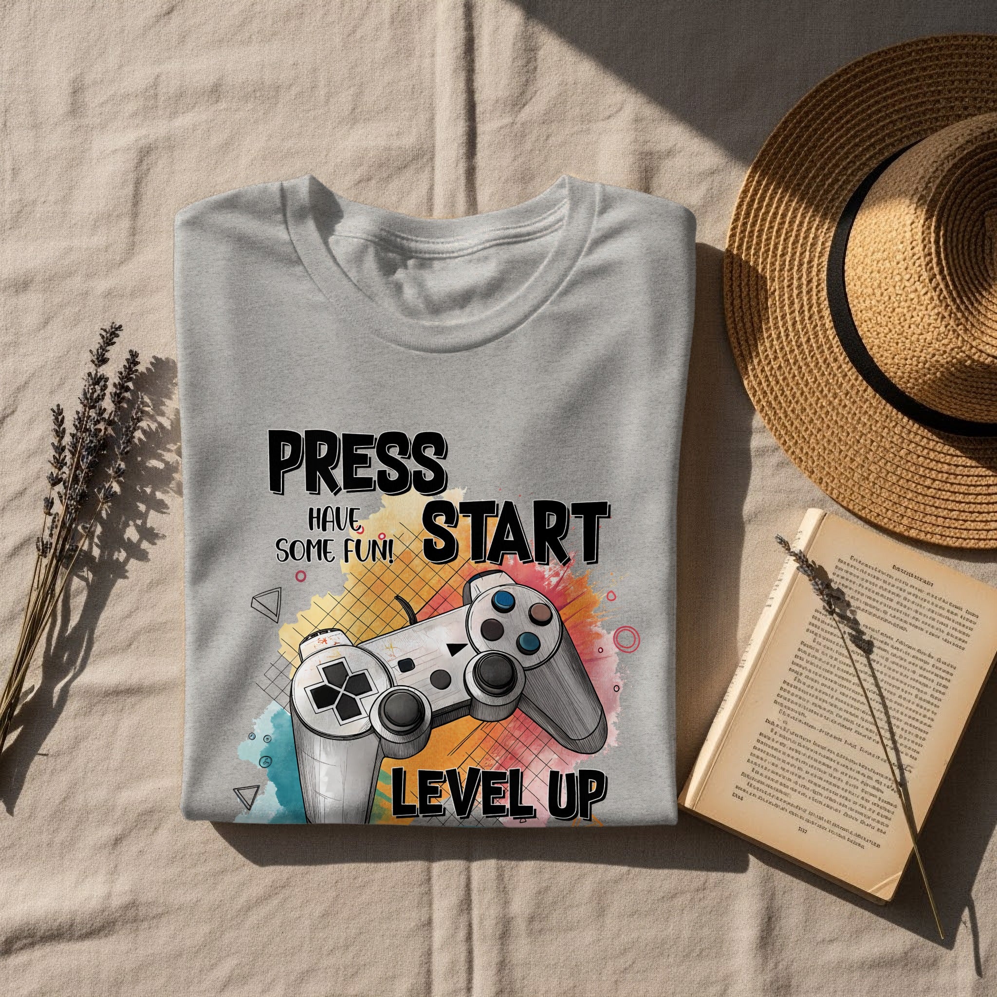 Gray t-shirt with "Press Start Have Some Fun Level Up" and video game controller graphic.