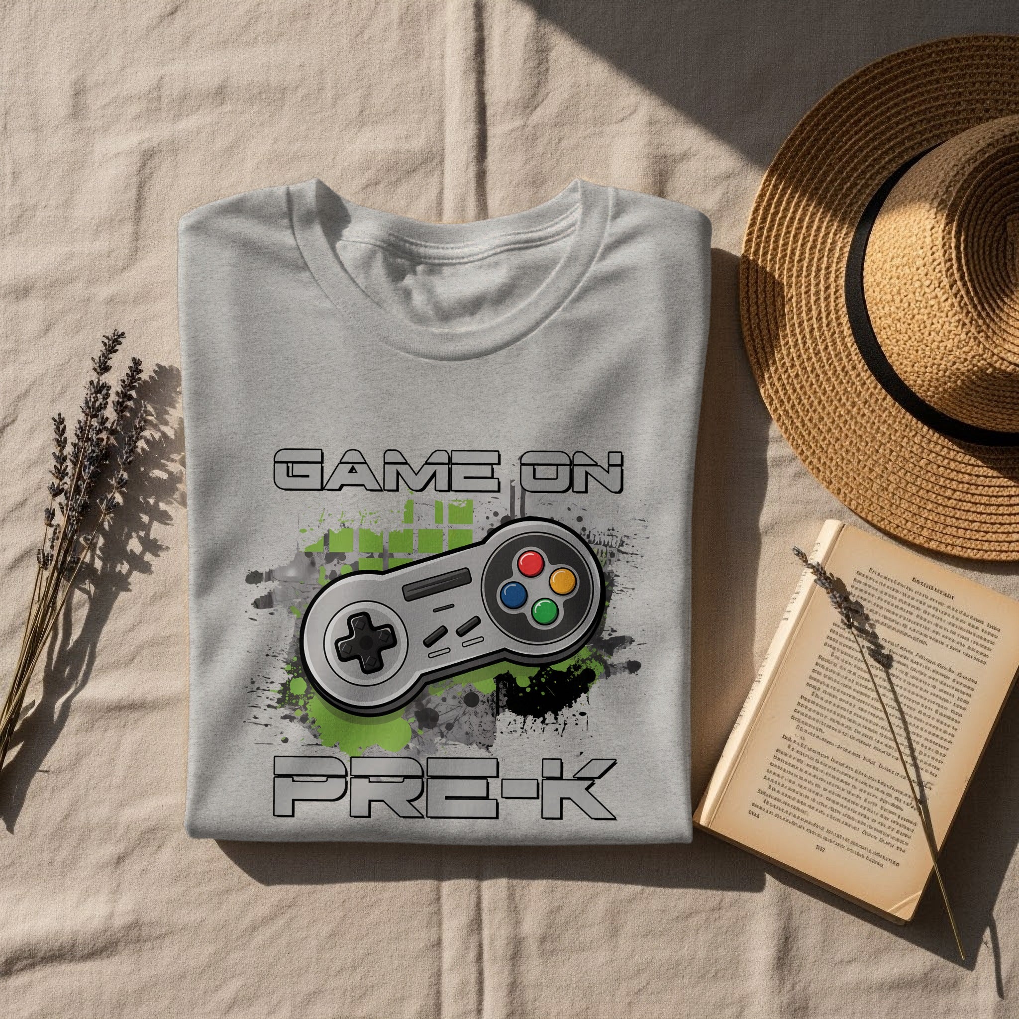 Gray t-shirt with "GAME ON PRE-K" text and video game controller graphic.
