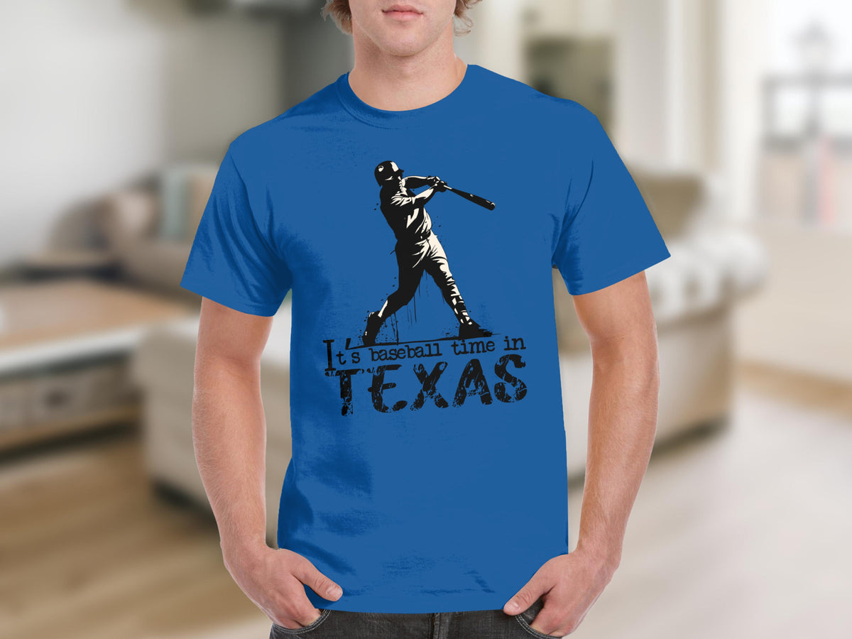 Blue t-shirt with silhouette of baseball player and text "It's baseball time in TEXAS."