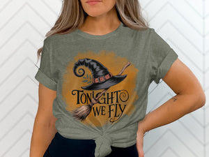 Gray t-shirt with graphic of a witch hat and broom and text "Tonight we fly".
