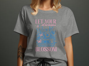 Grey t-shirt with pink text "LET YOUR dreams" and blue cassette tape graphic.