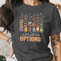 Dark grey t-shirt with five floral brooms and text "A girl's gotta have OPTIONS!".