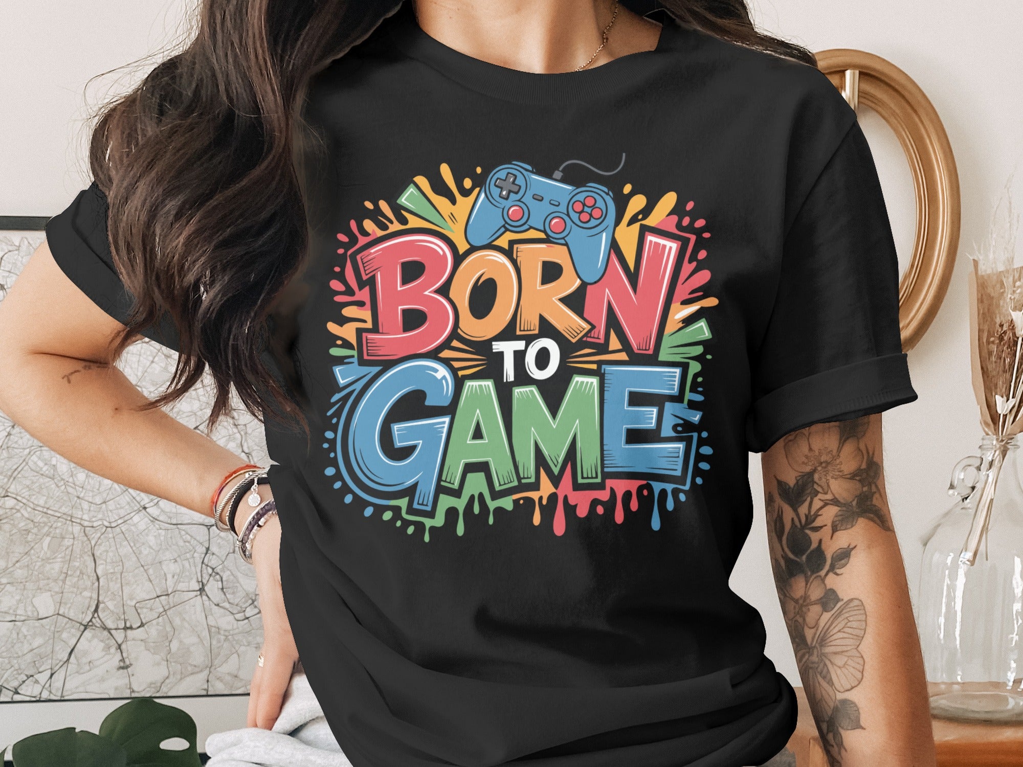 Black t-shirt with "BORN TO GAME" text and a video game controller graphic.